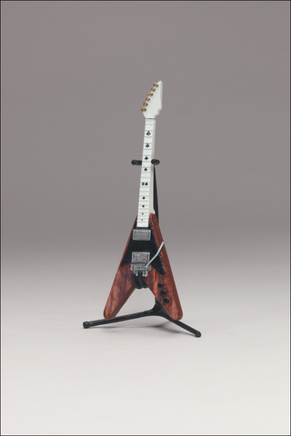 Illustration for article titled McFarlane's Tiny, Plastic Guitar Hero Guitars